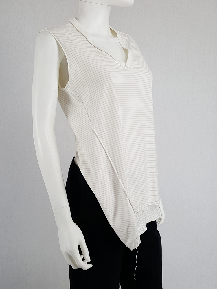 Maison Martin Margiela white top hanging on the front of the body ...