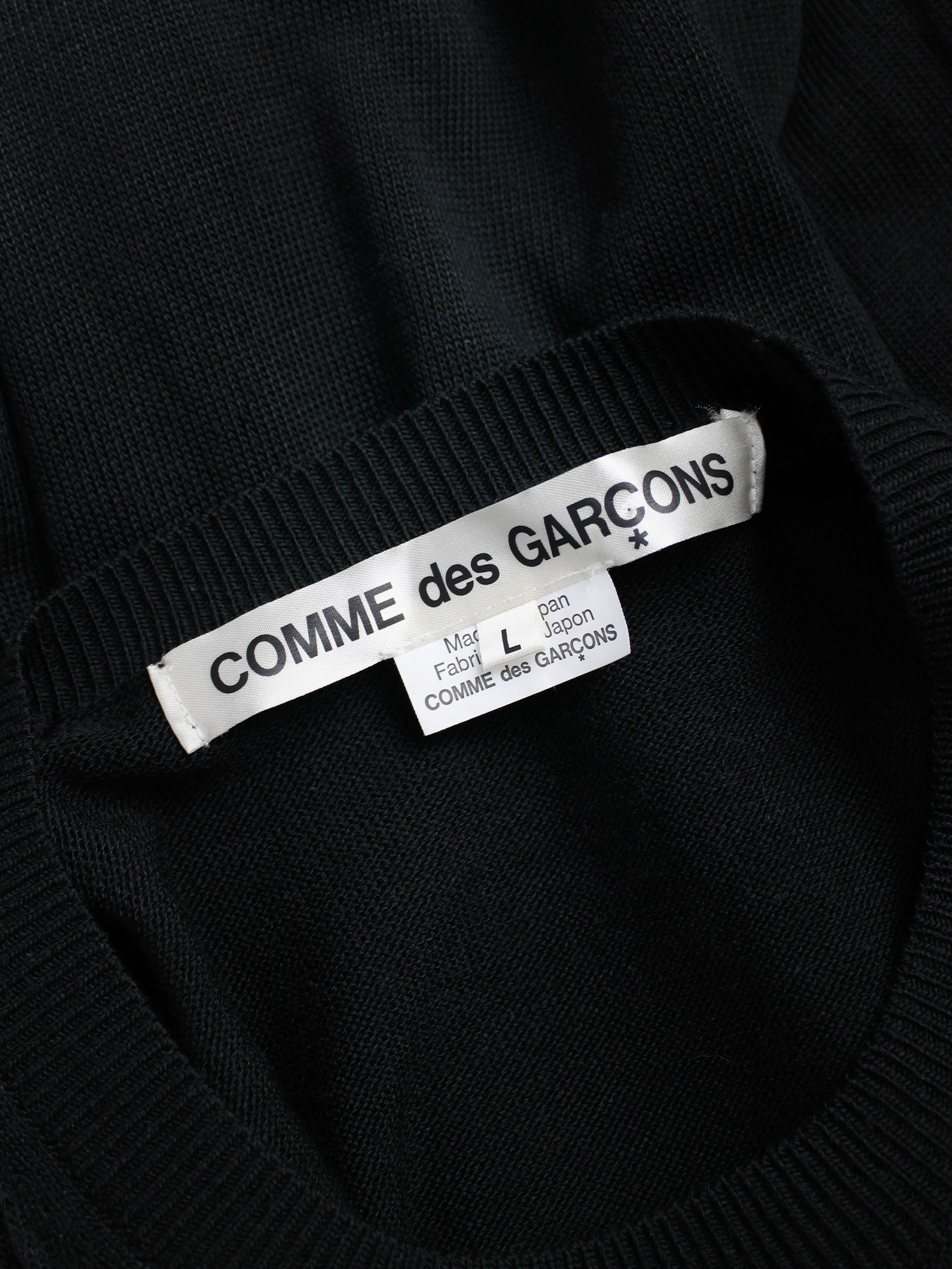 Comme des Garçons black knit top with long drooping strips — spring ...