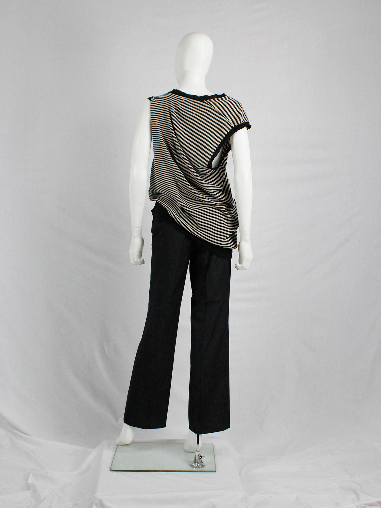 Maison Martin Margiela beige and black striped top, stretched out on ...
