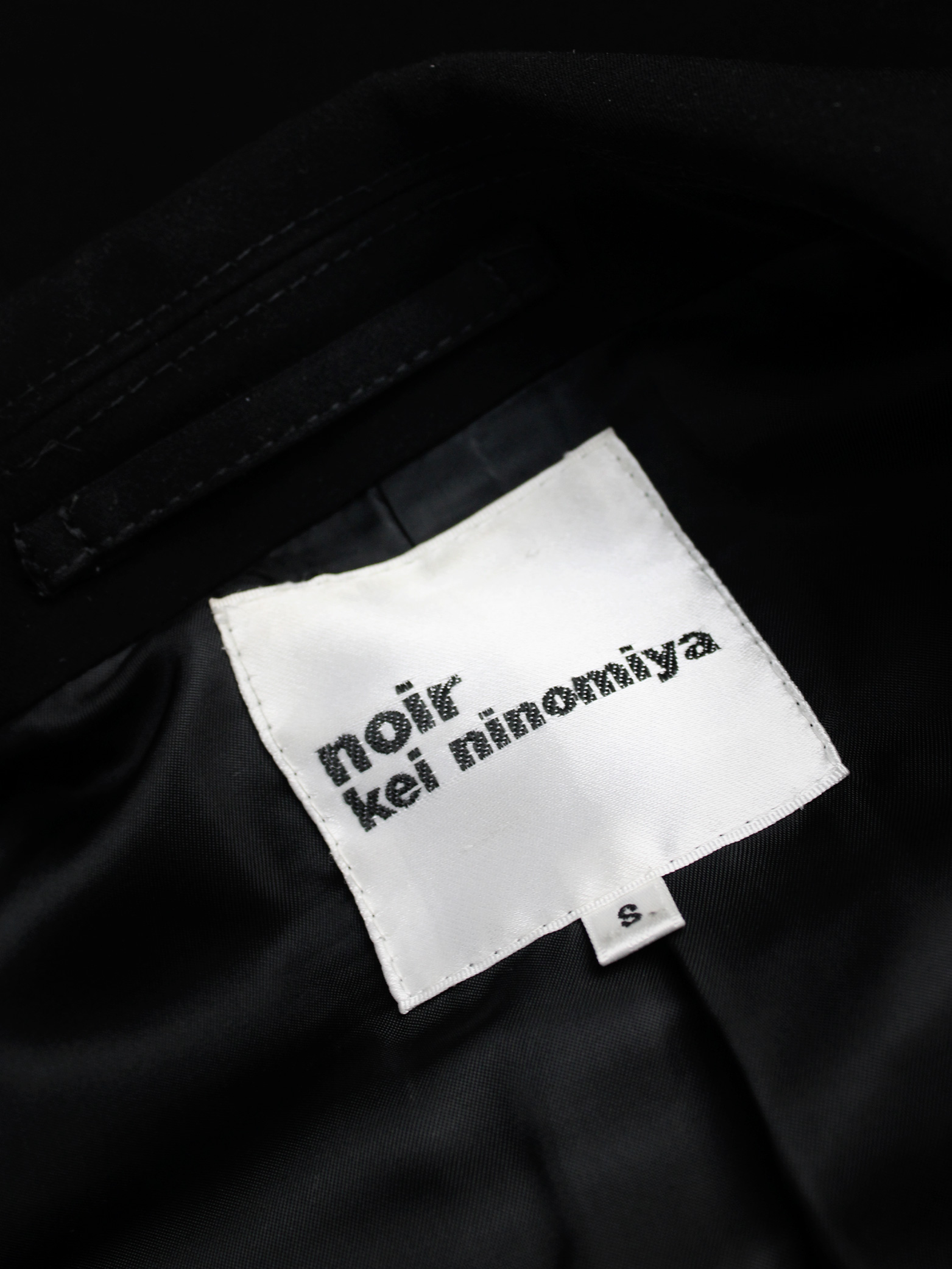 Noir Kei Ninomiya black biker jacket with pearls around the sleeves ...