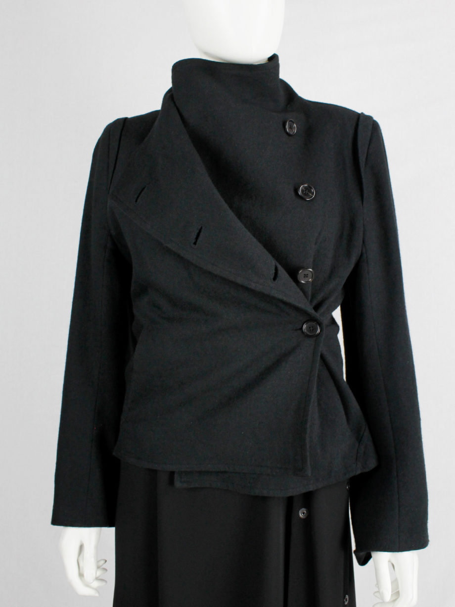 Ann Demeulemeester black coat with standing neckline and asymmetric button closure fall 2010 (14)
