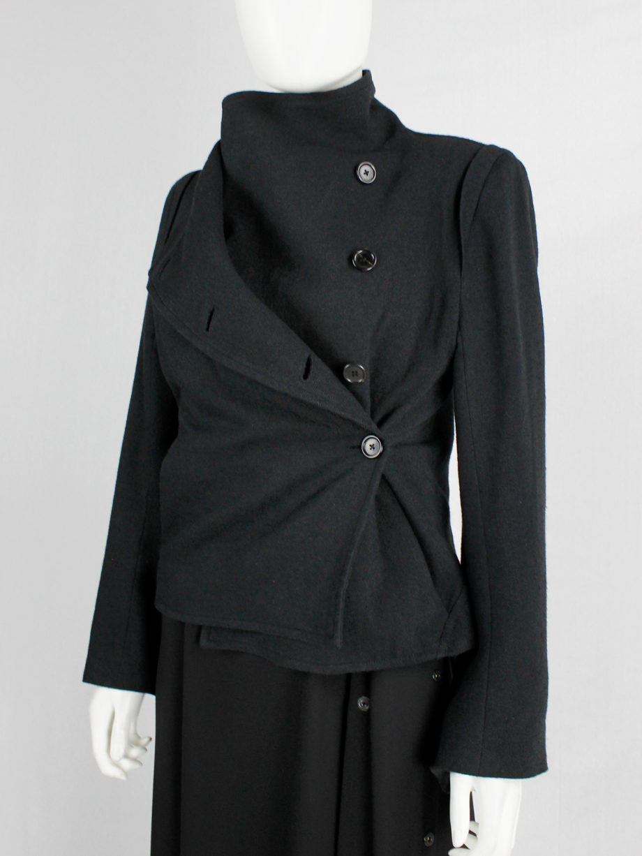Ann Demeulemeester black coat with standing neckline and asymmetric button closure fall 2010 (15)