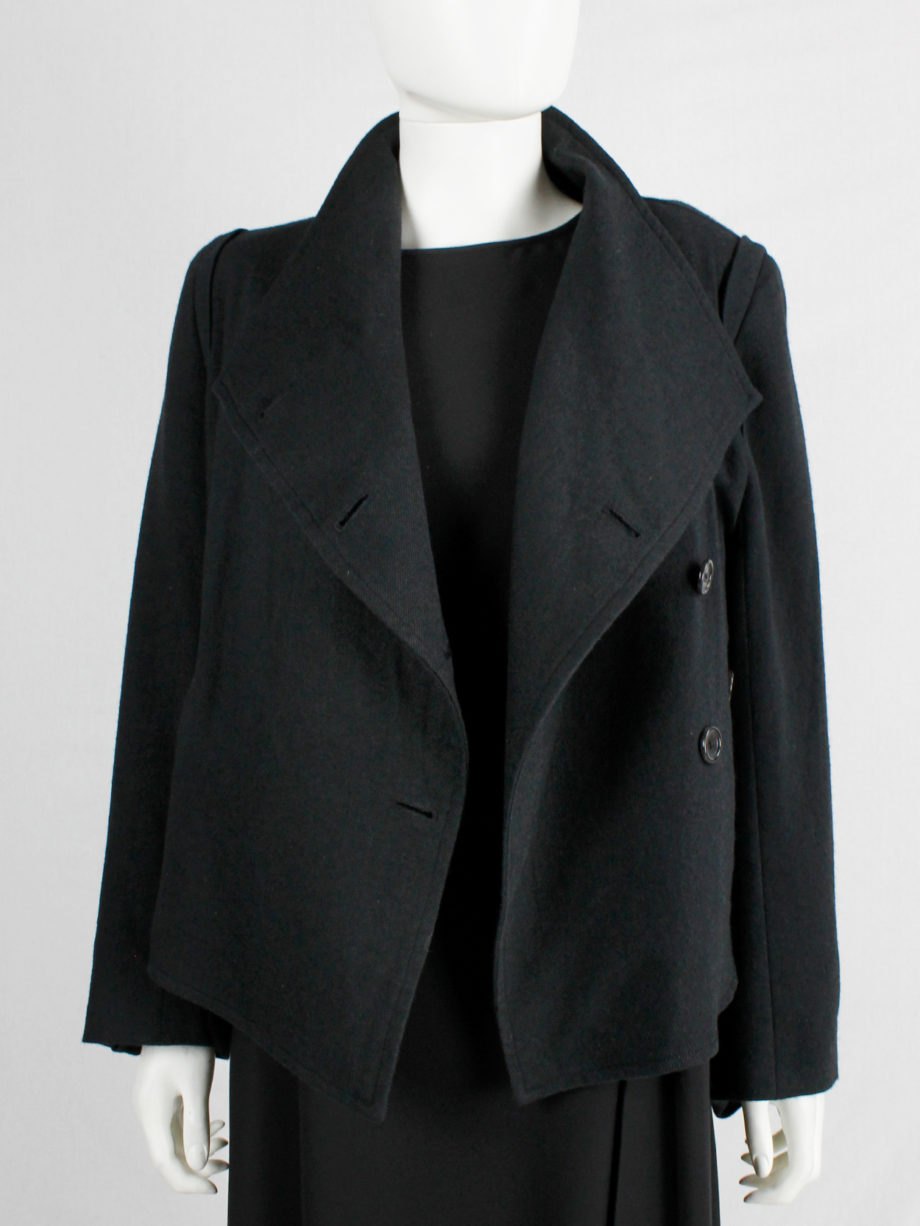 Ann Demeulemeester black coat with standing neckline and asymmetric button closure fall 2010 (6)