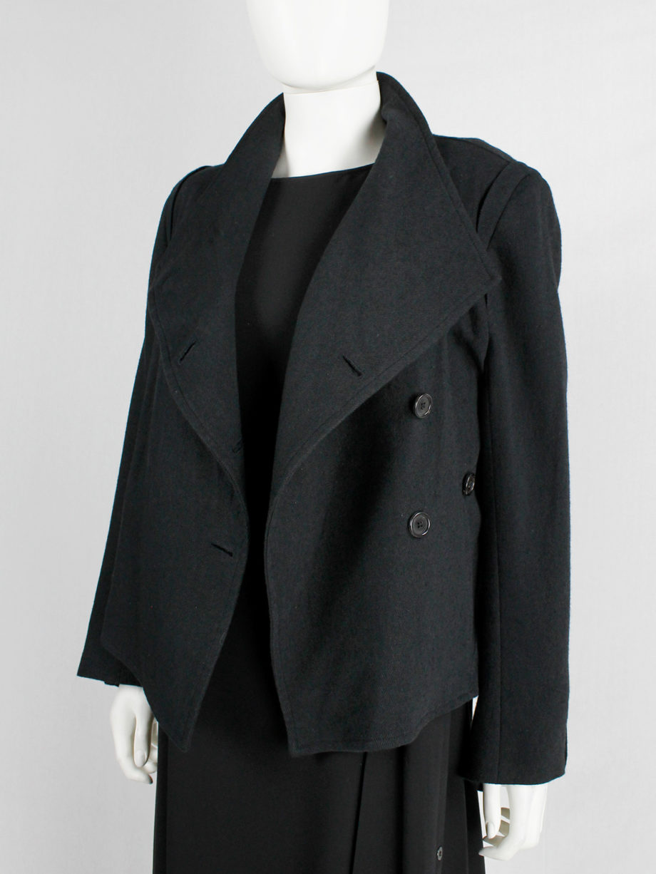 Ann Demeulemeester black coat with standing neckline and asymmetric button closure fall 2010 (7)