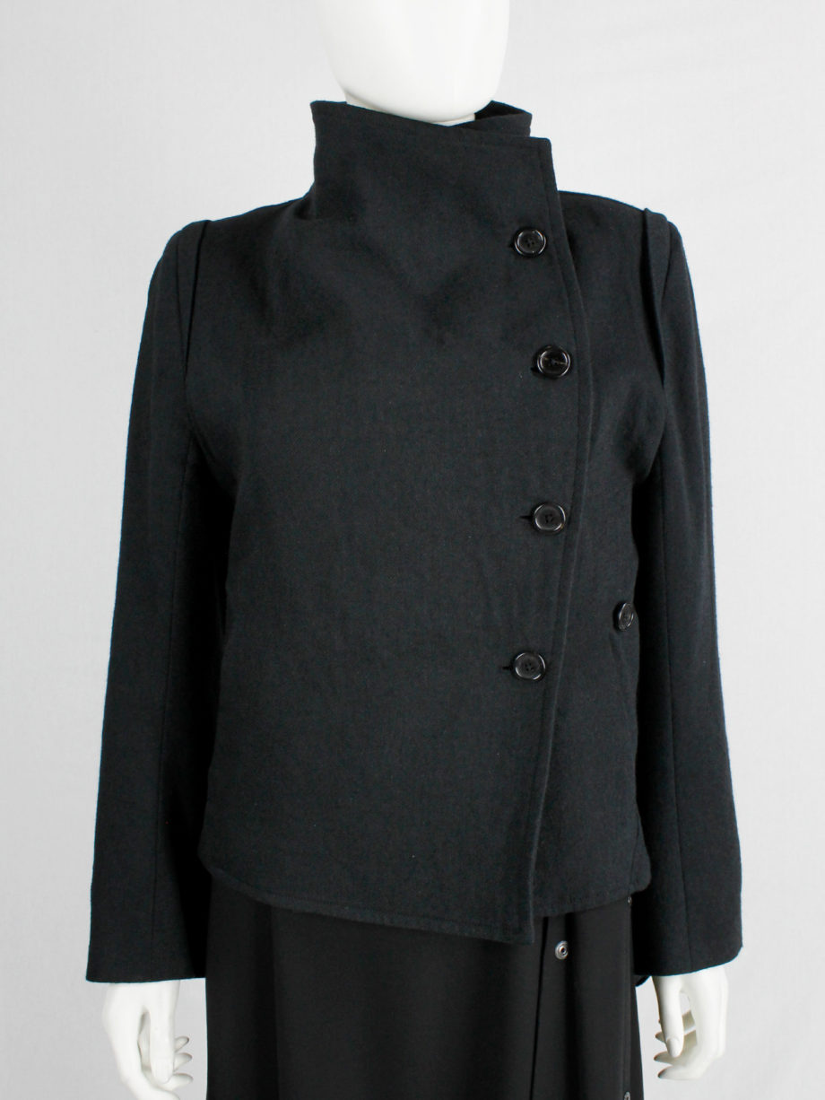 Ann Demeulemeester black coat with standing neckline and asymmetric button closure fall 2010 (8)
