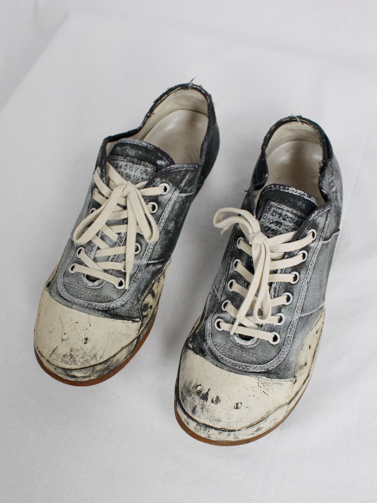 Maison Martin Margiela black and blue canvas sneakers painted in white ...