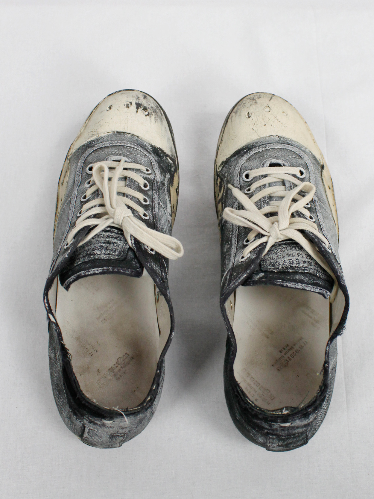Maison Martin Margiela black and blue canvas sneakers painted in white ...