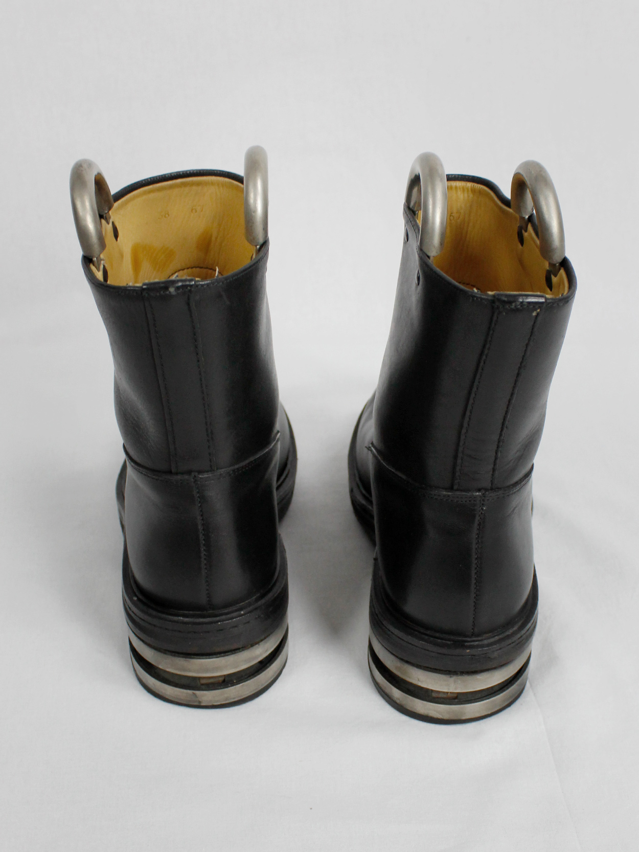 Dirk Bikkembergs black tall boots with metal slit heel and metal pulls ...