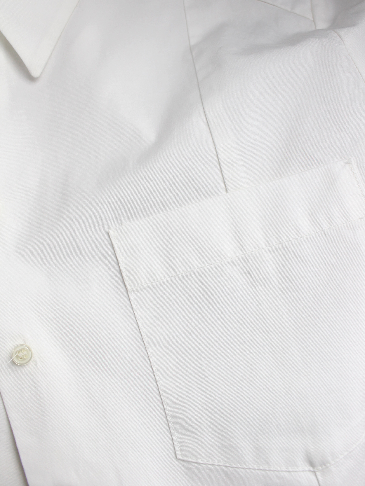 A.F. Vandevorst white backwards shirt with buttons and pocket at the ...