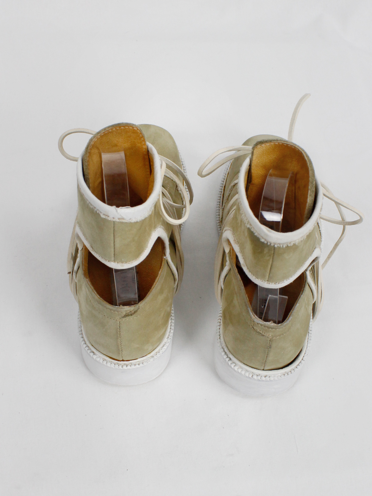 Dirk Bikkembergs beige cut out boots with white trim and laces through ...
