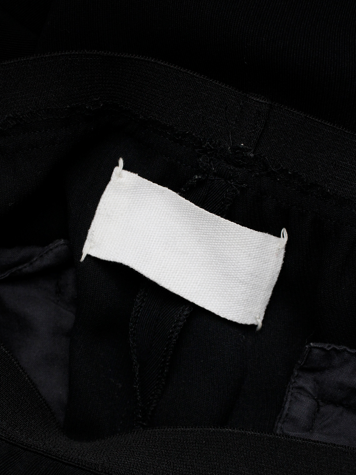 Maison Martin Margiela black trousers with seemingly stretched out ...