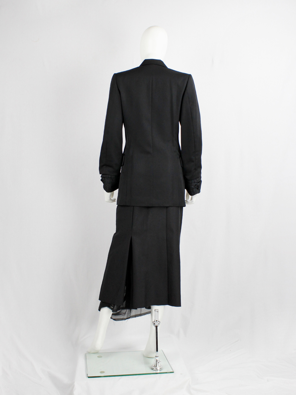 Comme des Garçons black blazer with scrunched lining coming out of the ...