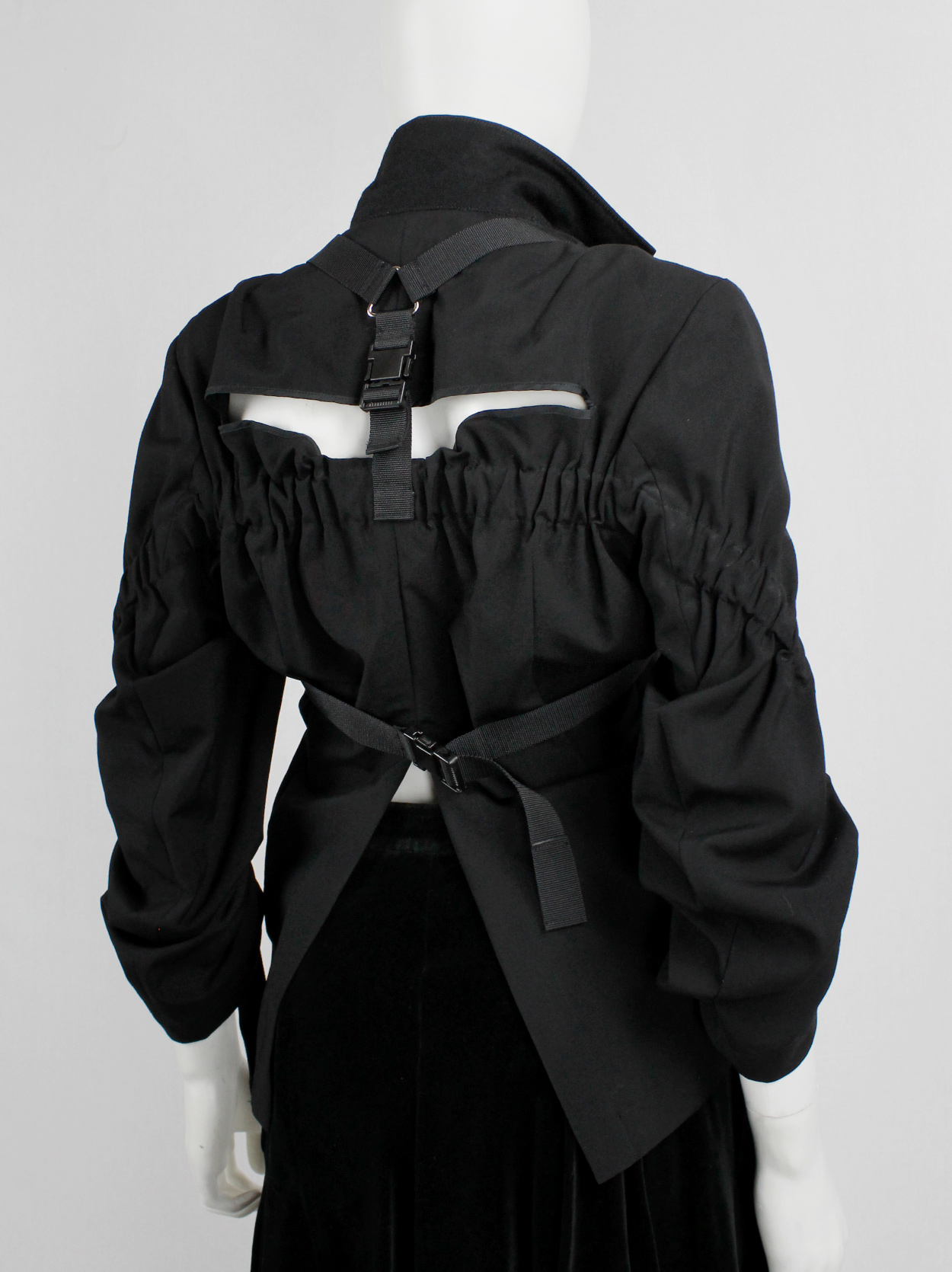 Junya Watanabe black parachute jacket with harness straps and open back ...