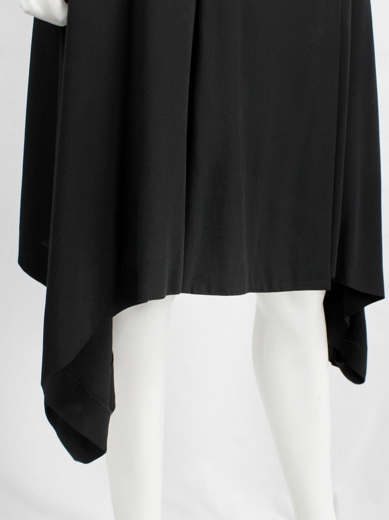 Ann Demeulemeester black skirt with buttons and curved hem — fall 2014 ...