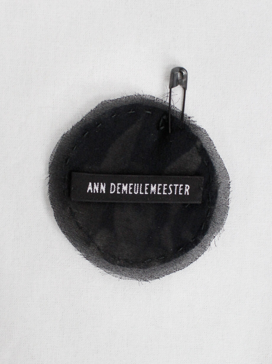 Ann Demeulemeester circle brooch with cherub print stitched onto black silk fall 2005 (1)