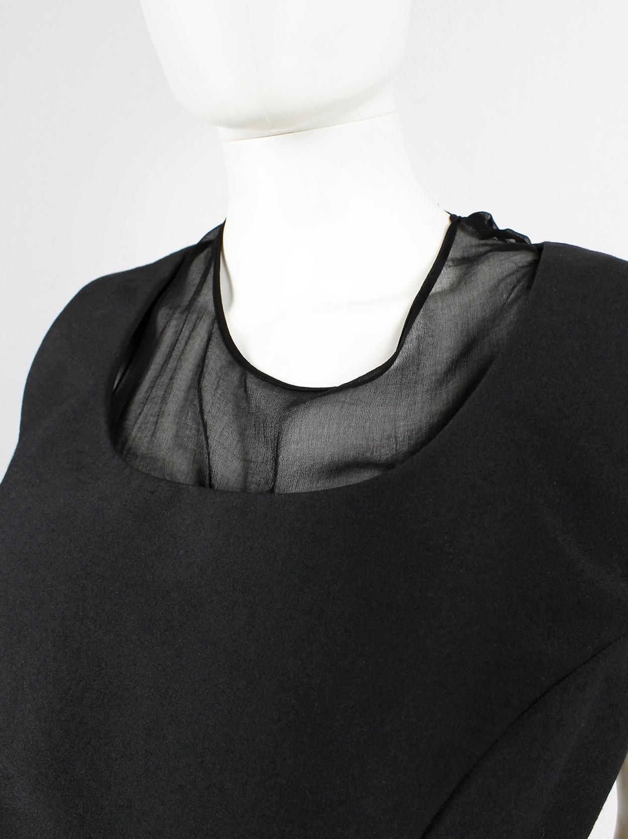 Comme des Garçons black panelled dress with faux fur trim on a sheer ...