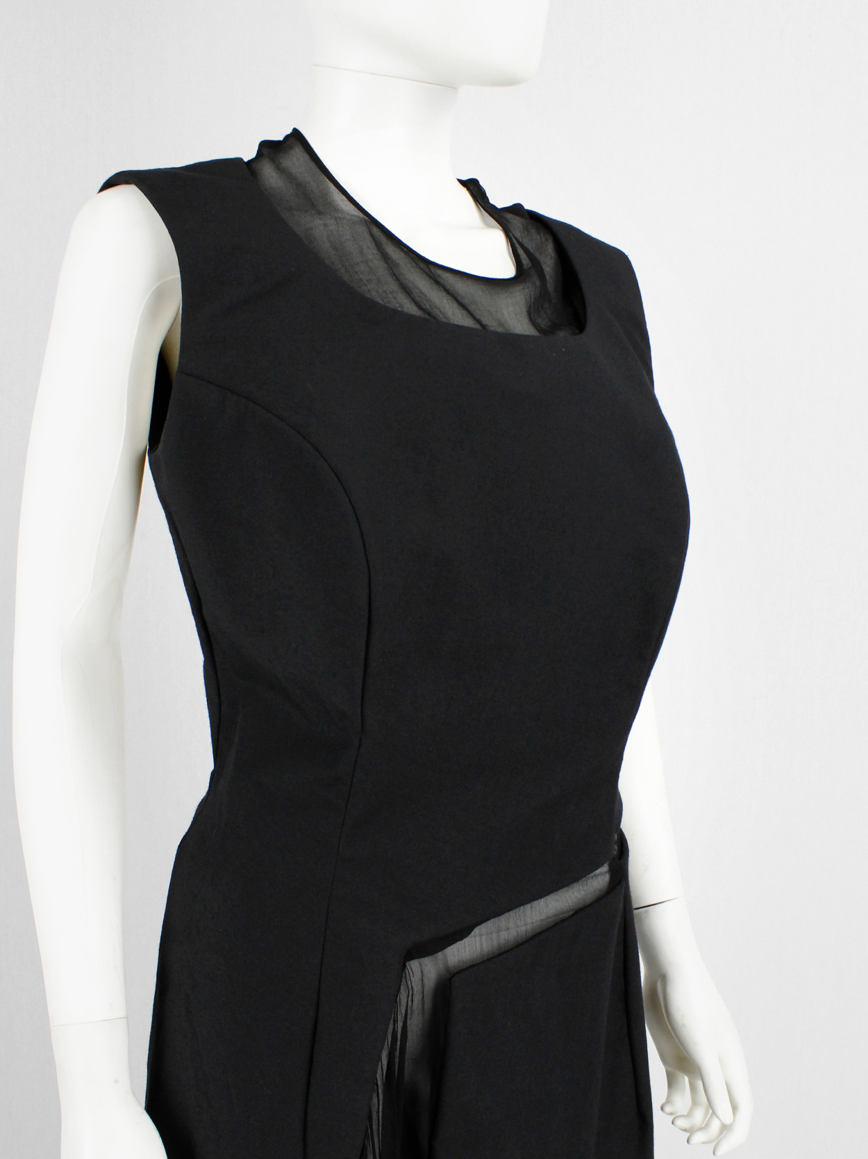 Comme des Garçons black panelled dress with faux fur trim on a sheer ...