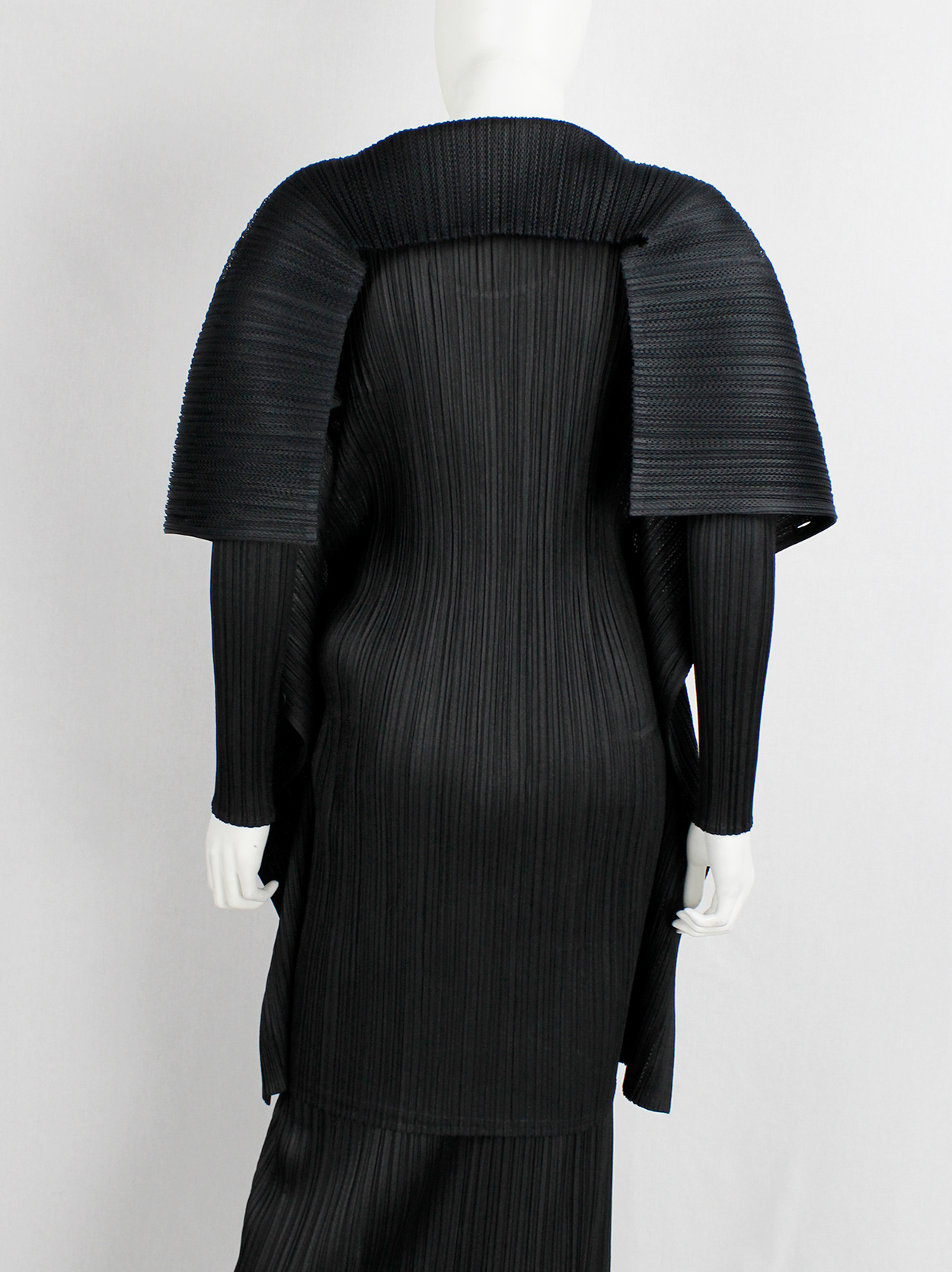 Issey Miyake Pleats Please black square jumper buttoned into a folded ...