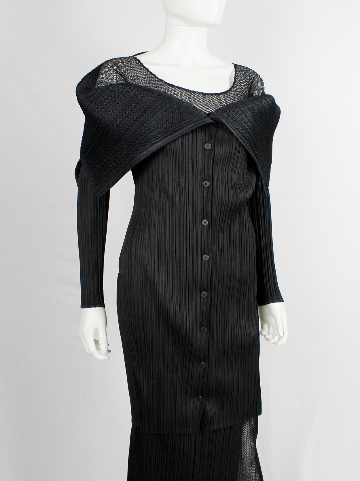 Issey Miyake Pleats Please black square jumper buttoned into a folded ...