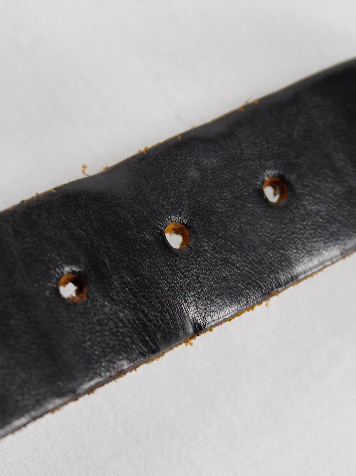 Lieve Van Gorp black leather belt bracelet with embossed logo - V A N ...