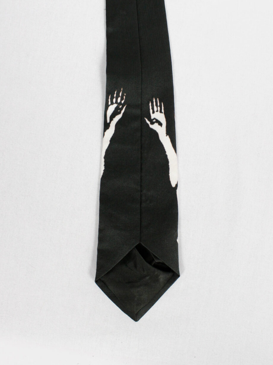 Christophe Coppens black tie with upside down bleached naked man in white (2)