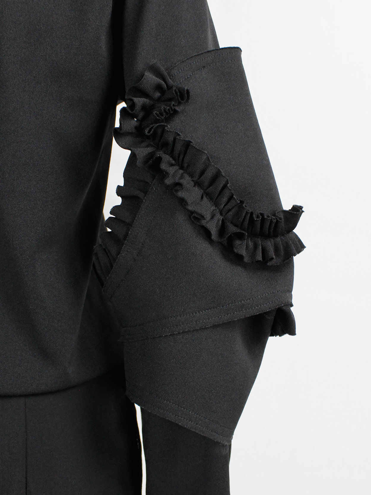 Comme des Garçons black jumper with three-dimensional armor sleeves ...