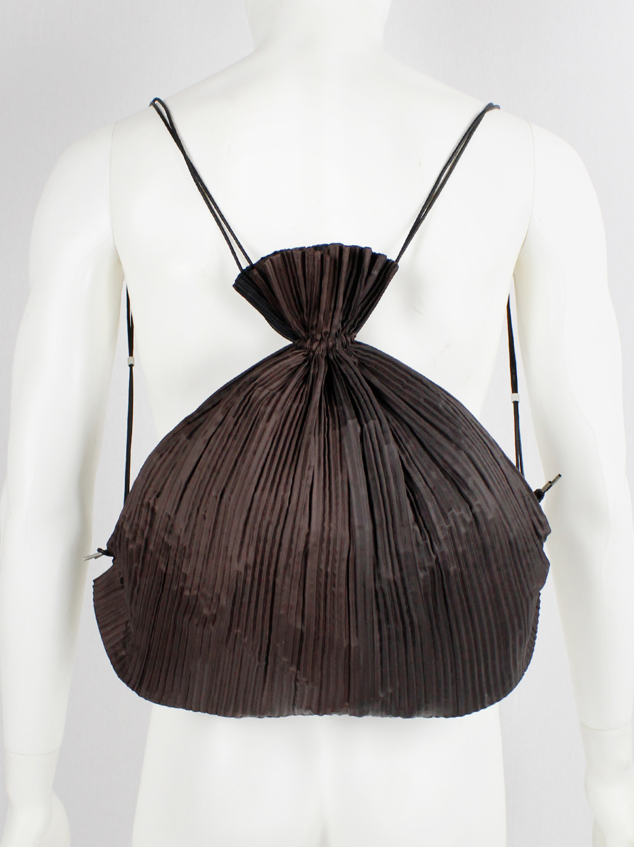 Issey Miyake dark brown drawstring backpack with fine pressed pleats ...
