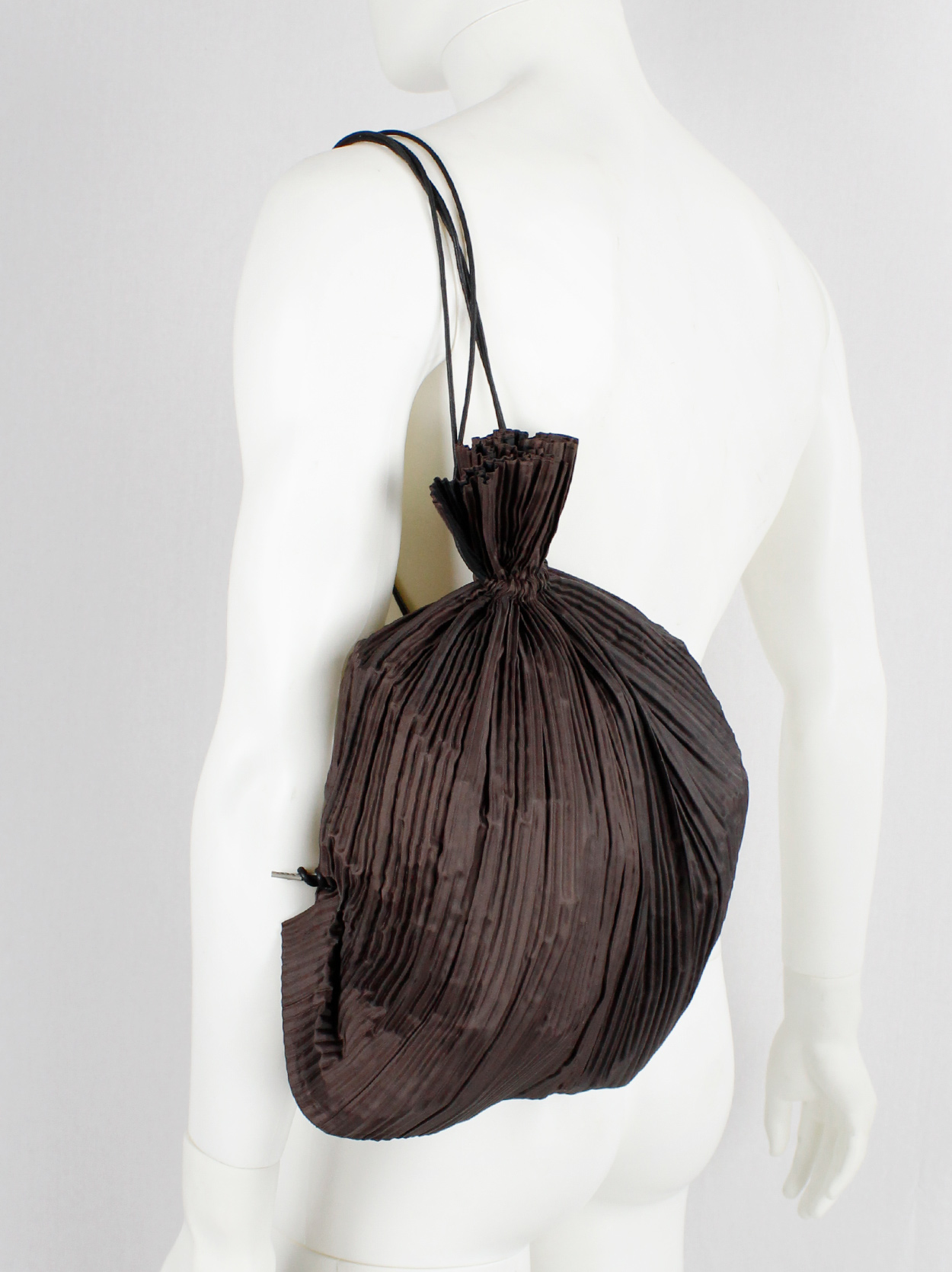 Issey Miyake dark brown drawstring backpack with fine pressed pleats ...
