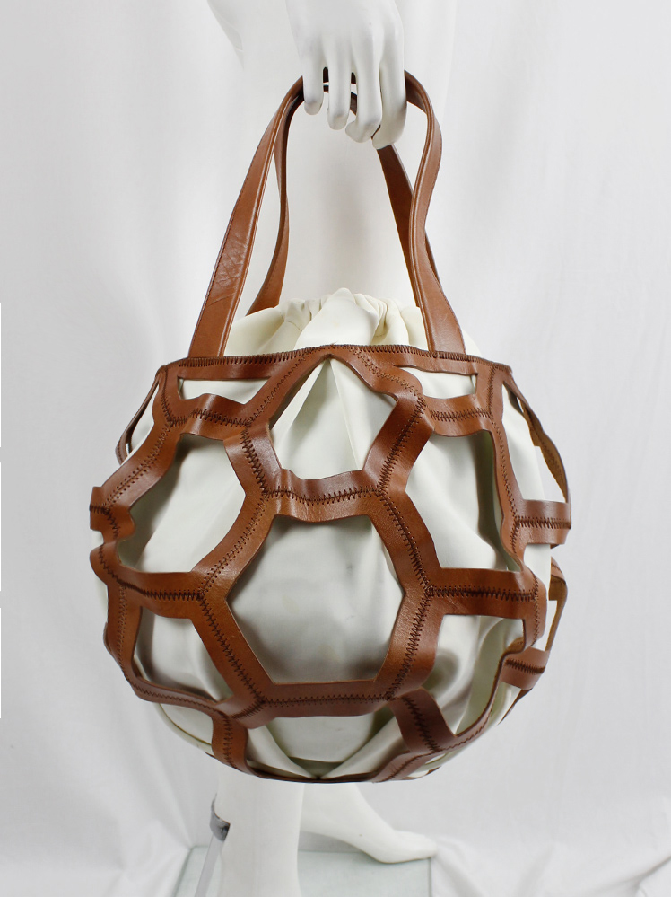 vintage Dirk Bikkembergs brown leather football bag with hexagonal cutouts over a white fabric bag (11)