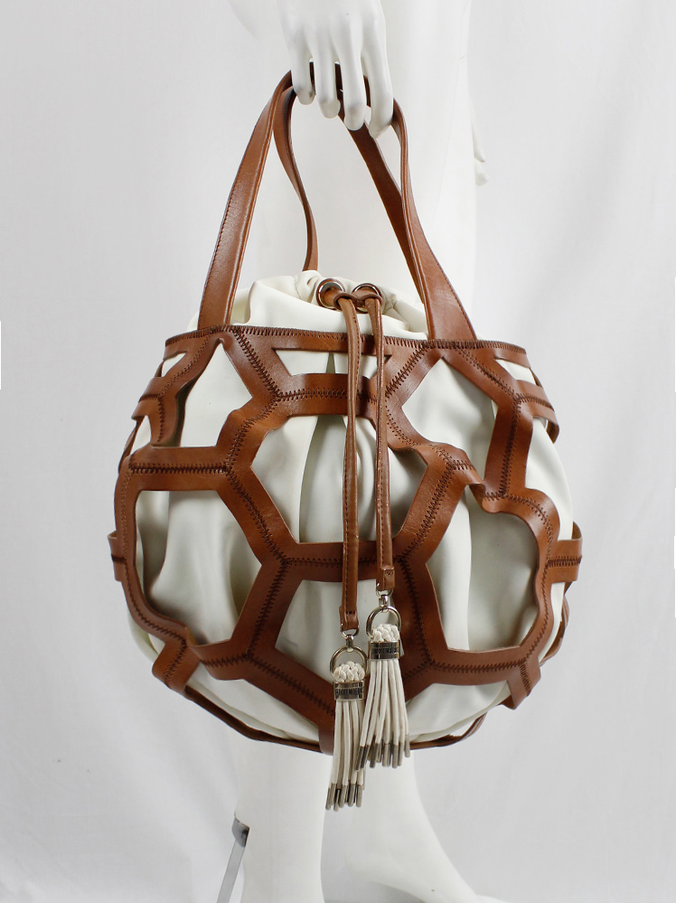 vintage Dirk Bikkembergs brown leather football bag with hexagonal cutouts over a white fabric bag (5)