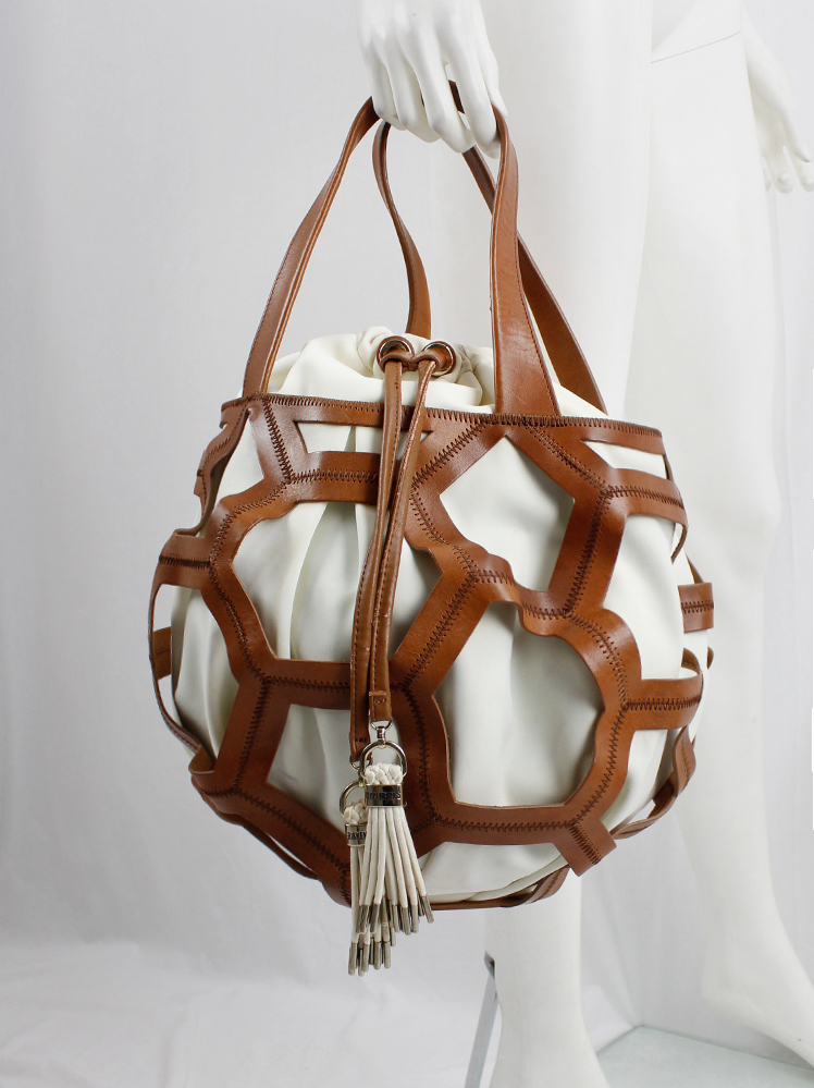 vintage Dirk Bikkembergs brown leather football bag with hexagonal cutouts over a white fabric bag (6)
