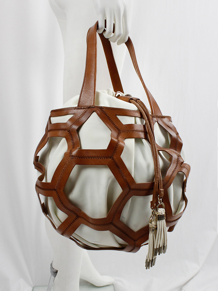 vintage Dirk Bikkembergs brown leather football bag with hexagonal cutouts over a white fabric bag (7)